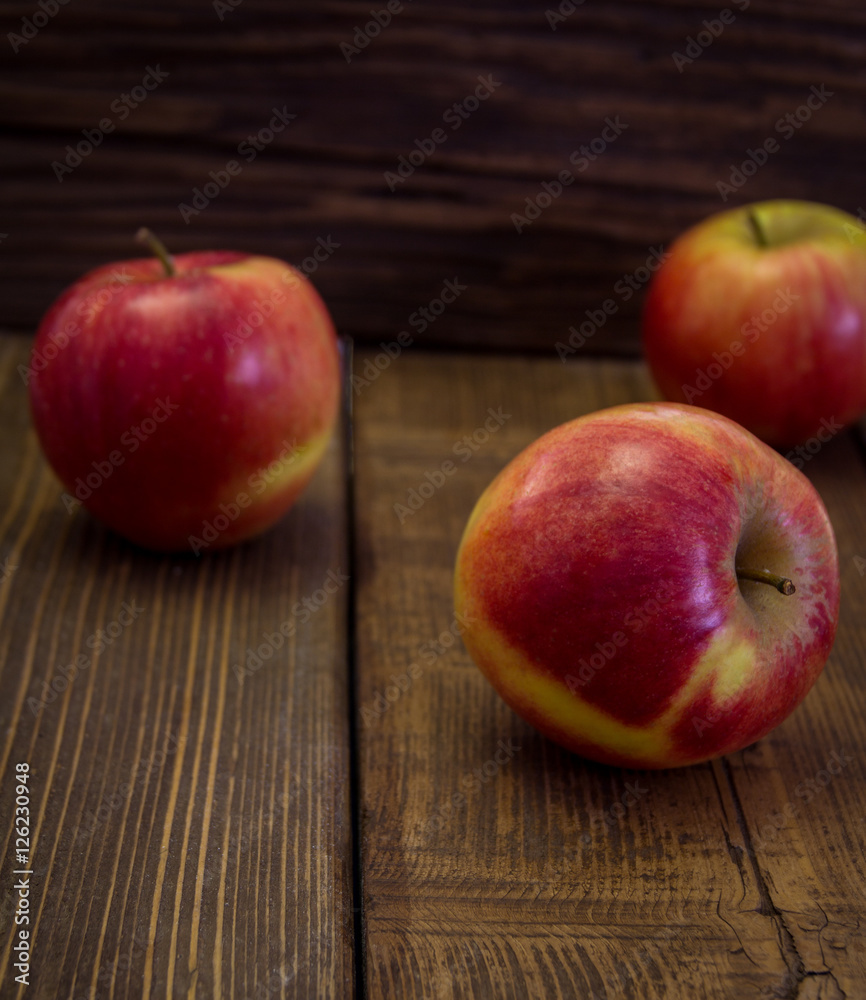 Red apples on a wooden table Red apples on a wooden table