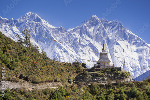 View of a Buddhist stupa with mountain Lhotse behind on the way from Namche Bazaar to Tengboche of the everest base camp trekking route.