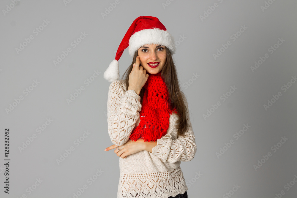 girl in santa hat and red scarf