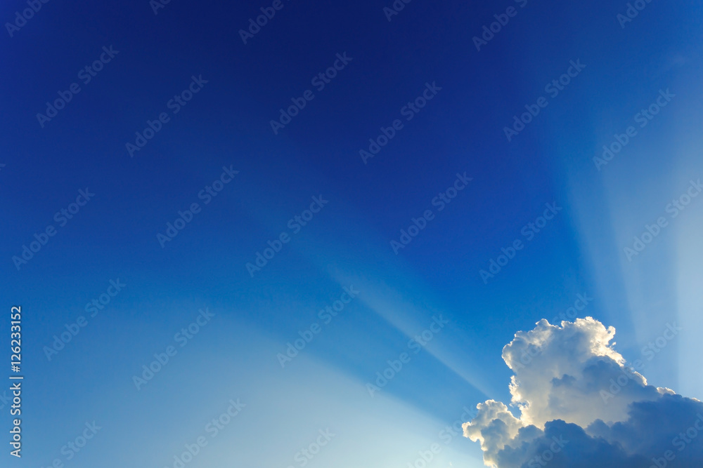 light rays on dramatic moody blue sky light rays on dramatic moody blue sky