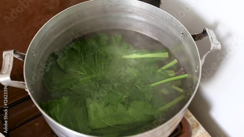 Grape leaves are boiled in a pot for dolma HD
