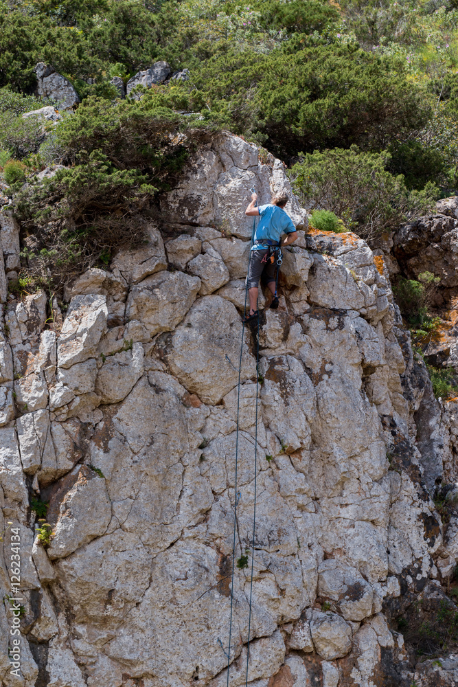 Man climbs a cliff