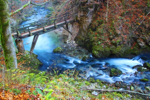 River Kamacnik in Croatia. Old bridge over long exposed water flow.
