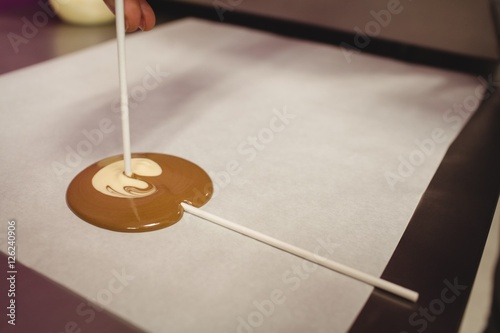 Preparation of lollipop on wax paper