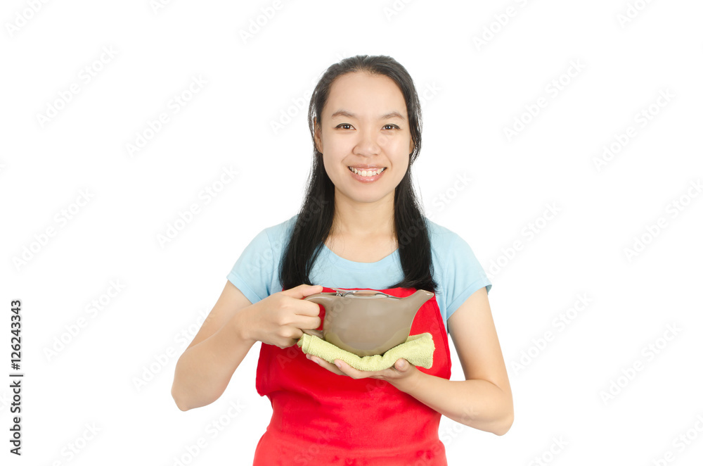 Woman wearing red apron and holding teapot isolated on white background Woman wearing red apron and holding teapot isolated on white background