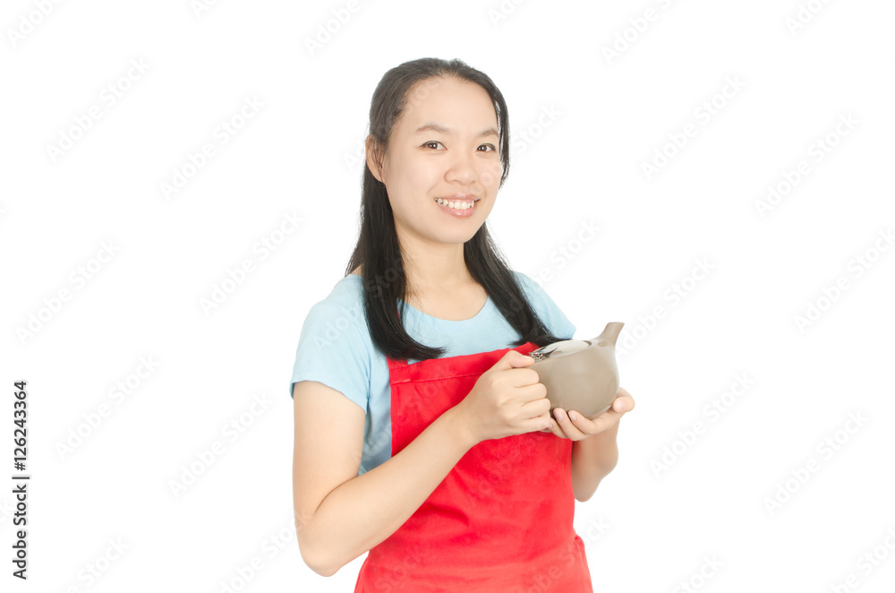 Woman wearing red apron and holding teapot isolated on white background Woman wearing red apron and holding teapot isolated on white background