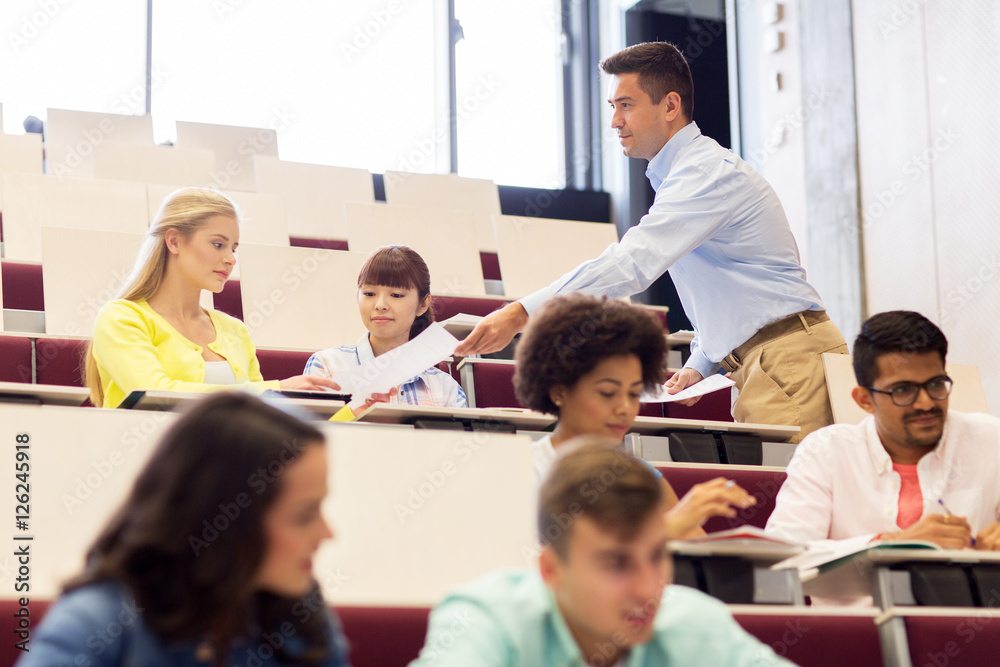 teacher giving test to students on lecture teacher giving test to students on lecture