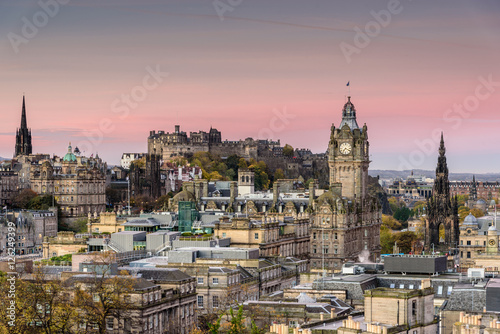 Pink sunrise over the city of Edinburgh - popular cityscape of the historical town center with the view towards Edinburgh castle