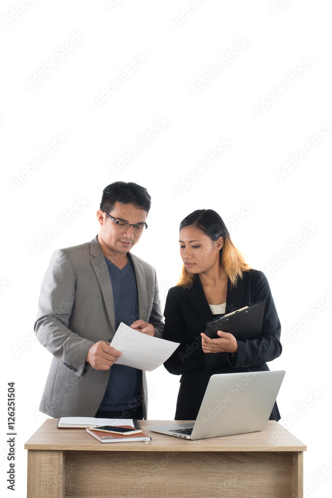 Young business woman standing with her boss conversation about t Young business woman standing with her boss conversation about t