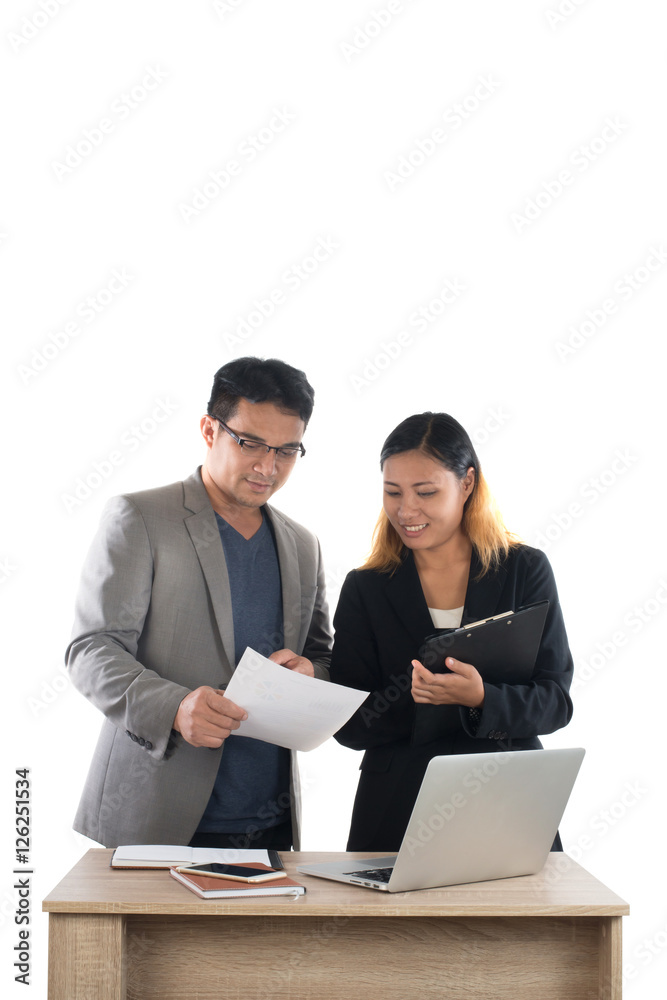 Young business woman standing with her boss conversation about t Young business woman standing with her boss conversation about t