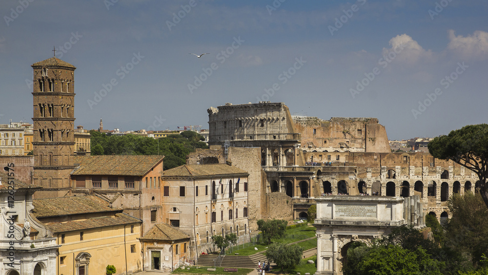 Coloseum viewed through ancient ruins