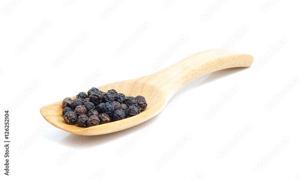 Pepper corn in wood spoon on white background. Pepper corn in wood spoon on white background.