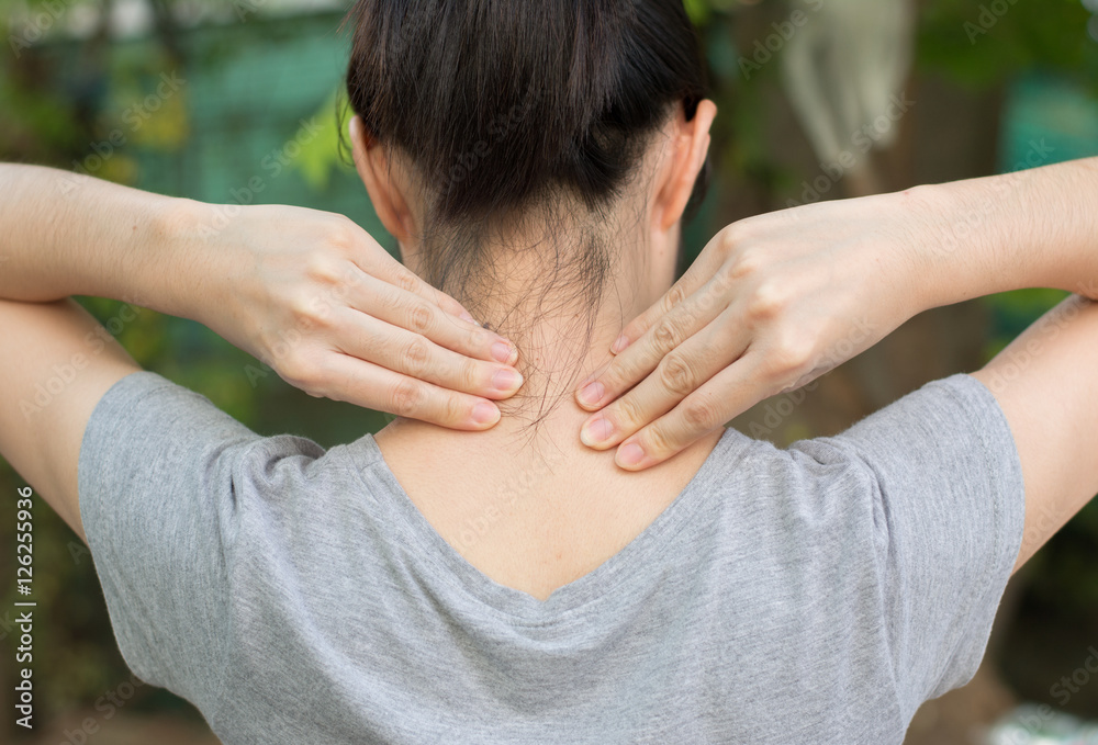 Fototapeta premium Woman's hand on her neck,Medical concept,