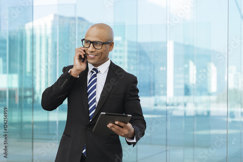 Afro american businessman talking on mobile phone