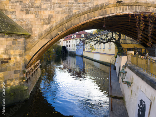Certovka ( Devil's canal ), Kampa and Charles Bridge, Prague, Czech Republic / Czechia - pillar, canal of Vltava river and historic buildings. Picturesque water channel © M-SUR