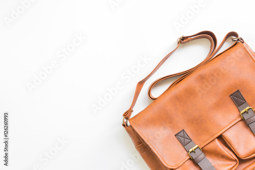 Men's accessories with brown leather bags, flat lay, top view.