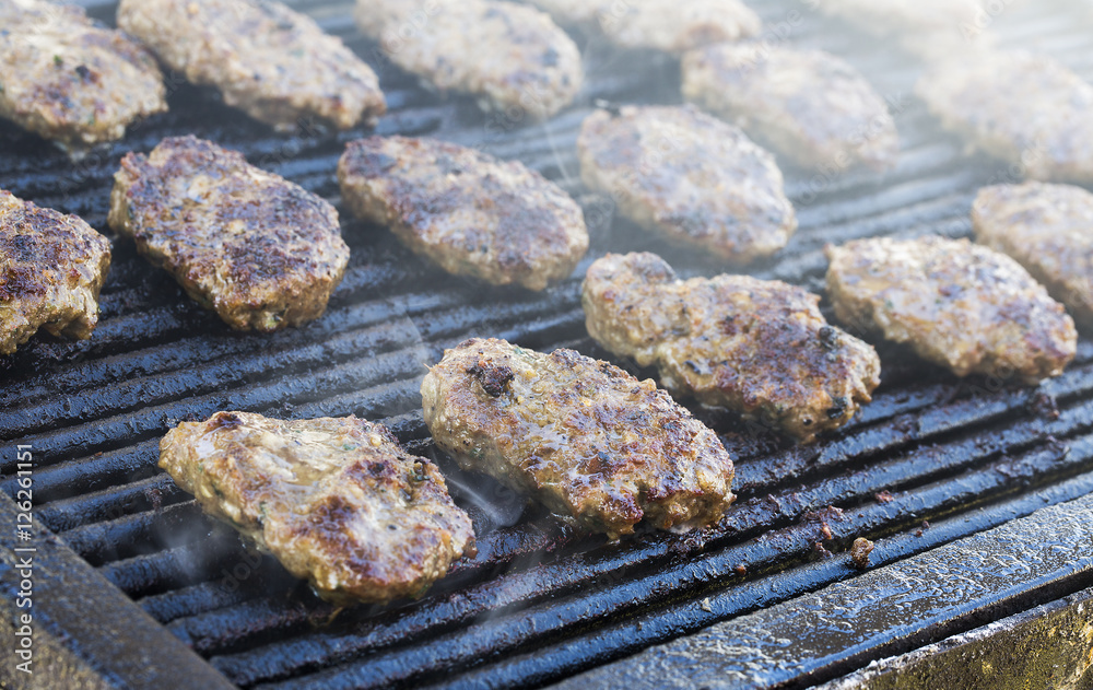 Meatballs on smoking grill. Barbecue in nature Meatballs on smoking grill. Barbecue in nature