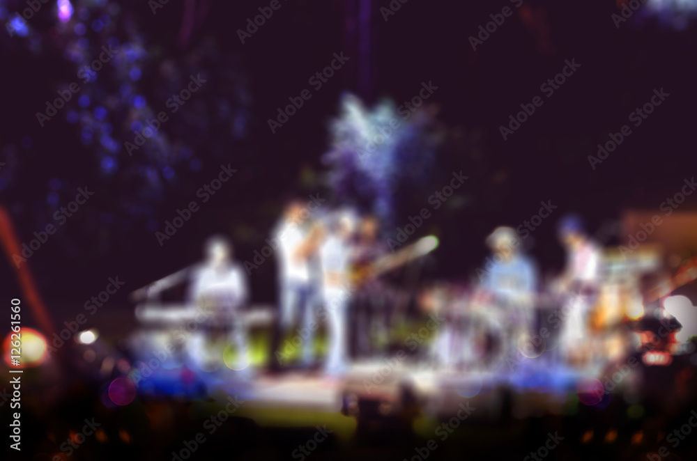 Blur background of live music at garden with bokeh light