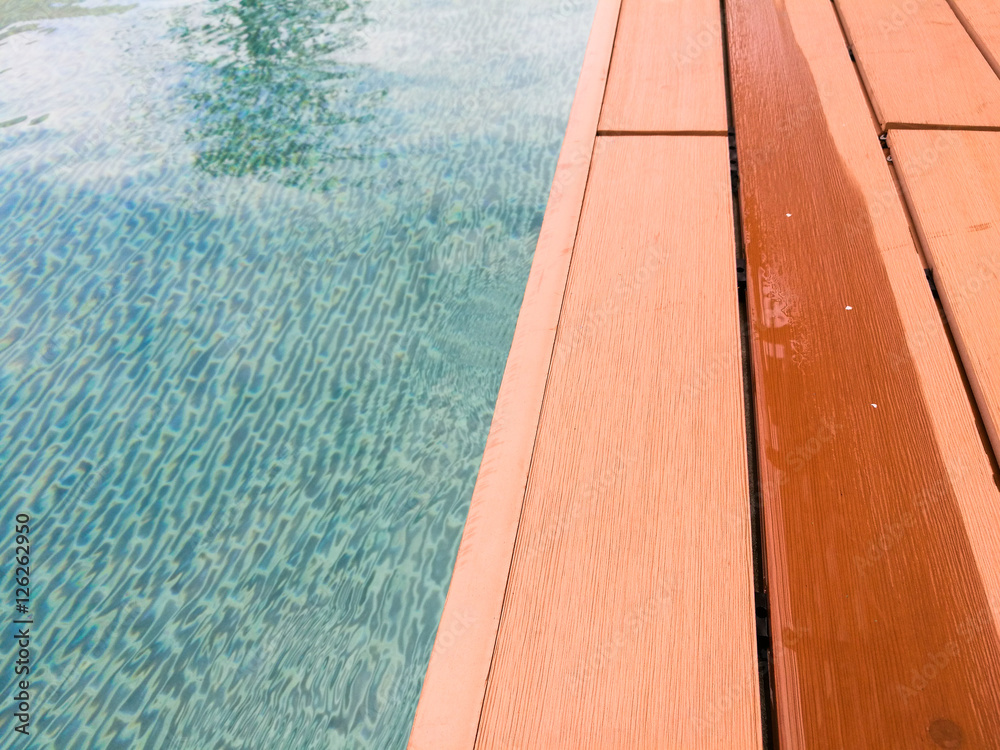 Obraz premium swimming pool with wooden path