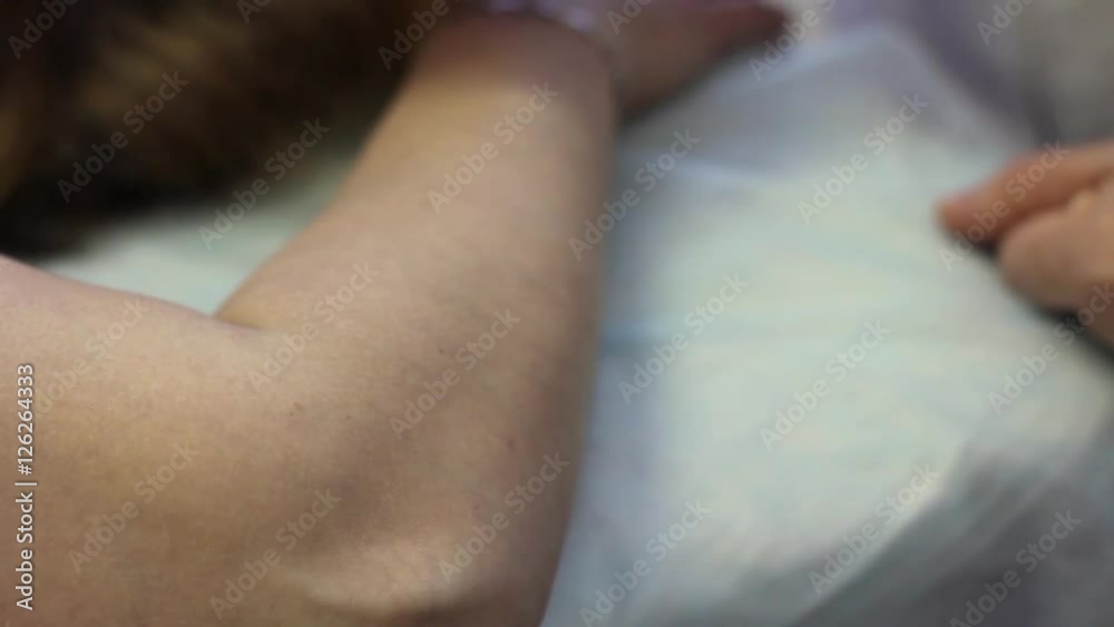 Acupuncture. The doctor sets the needle in the patient's arm Acupuncture. The doctor sets the needle in the patient's arm