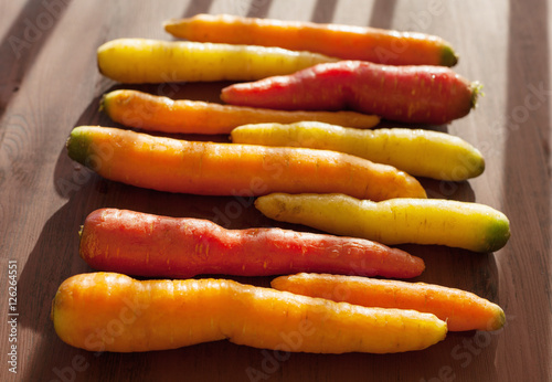 raw colorful carrot vegetable on wooden background