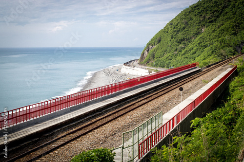 Train approaching the Duoliang Station at the coast in Taitung. Duoliang Station is the most beautiful train station in Taiwan. photo