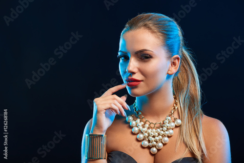 Closeup glamour fashion portrait of young woman photo
