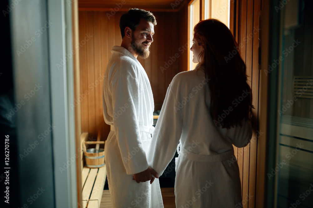 Beautiful couple relaxing in sauna Beautiful couple relaxing in sauna