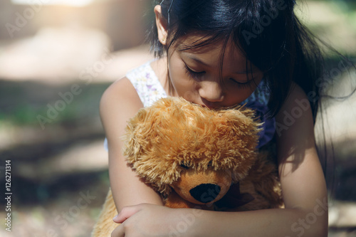 Asia Lovely girl sad mood Hug teddy bear