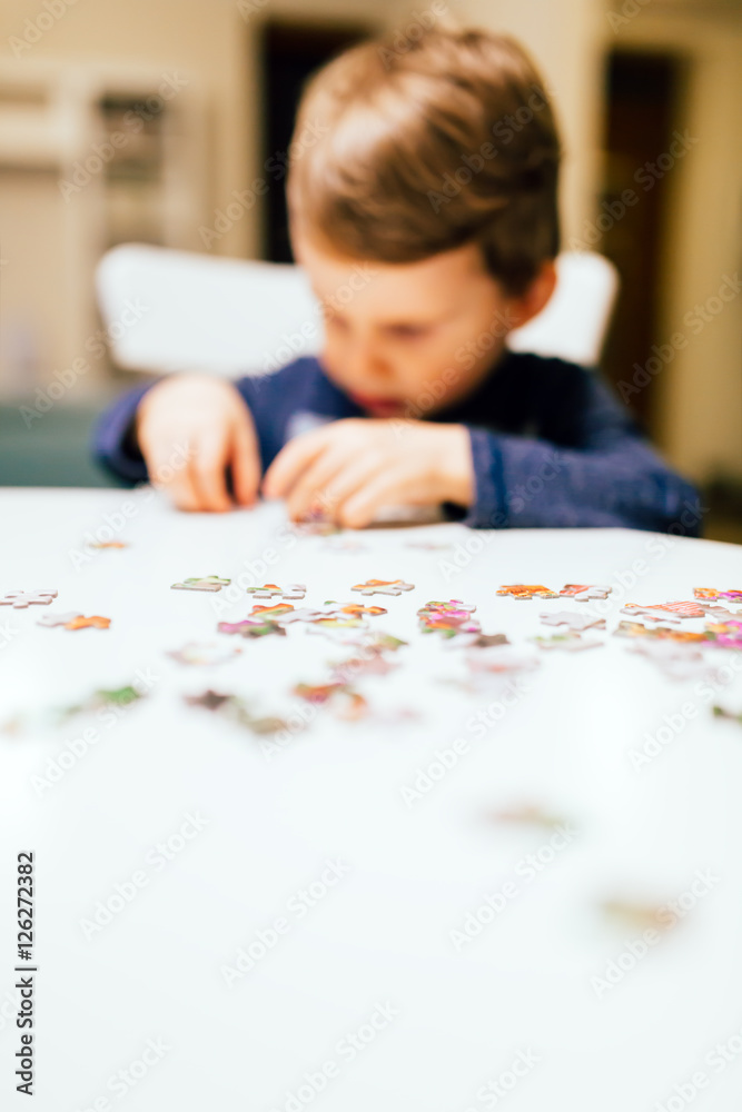 2 year old child solving jigsaw puzzle 2 year old child solving jigsaw puzzle