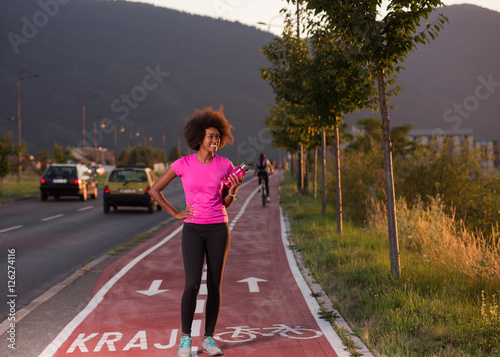 Portrait of a young african american woman running outdoors