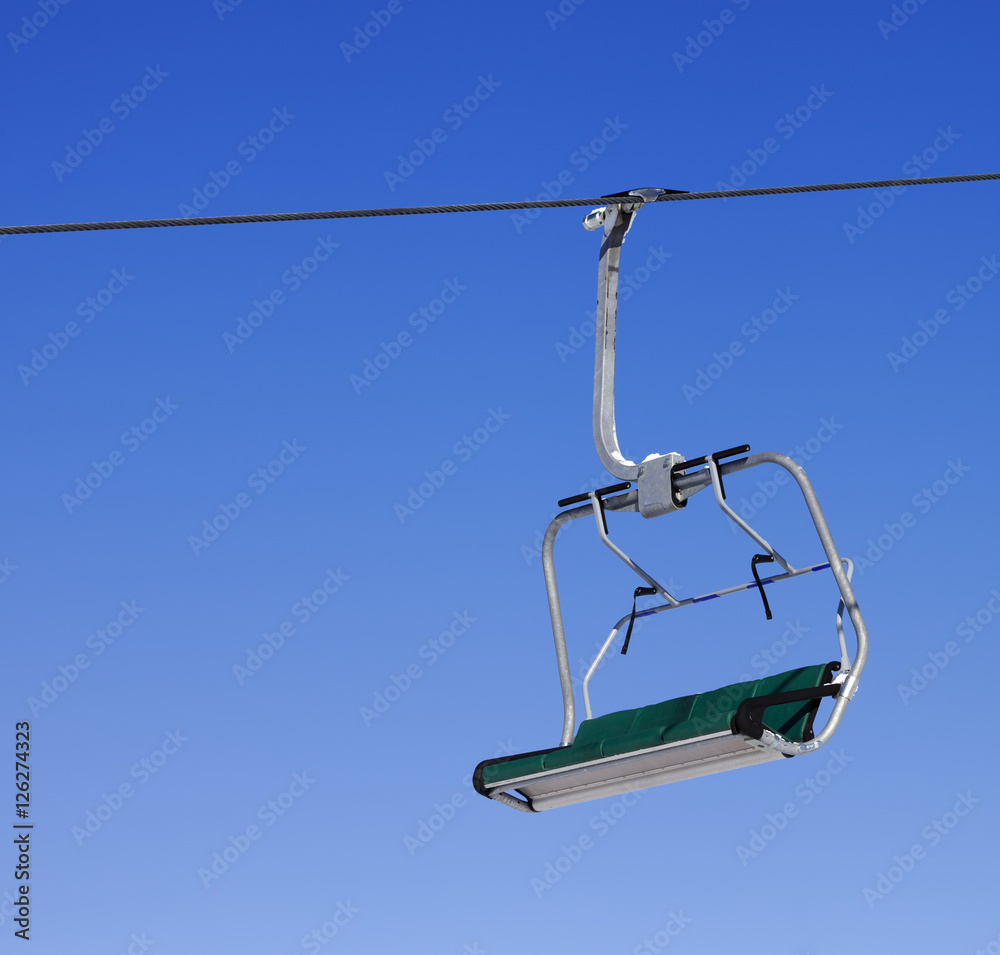 Chair-lift at ski resort and blue clear sky Chair-lift at ski resort and blue clear sky