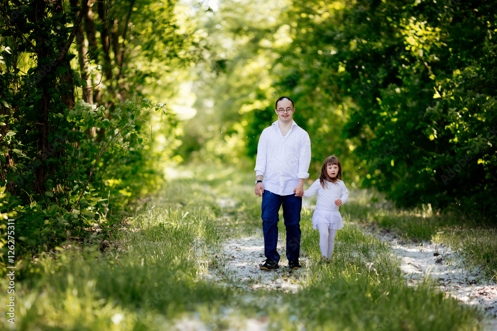 Fototapeta premium People with down sydrome walking in forest