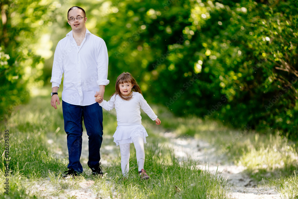 Fototapeta premium People with down sydrome walking in forest