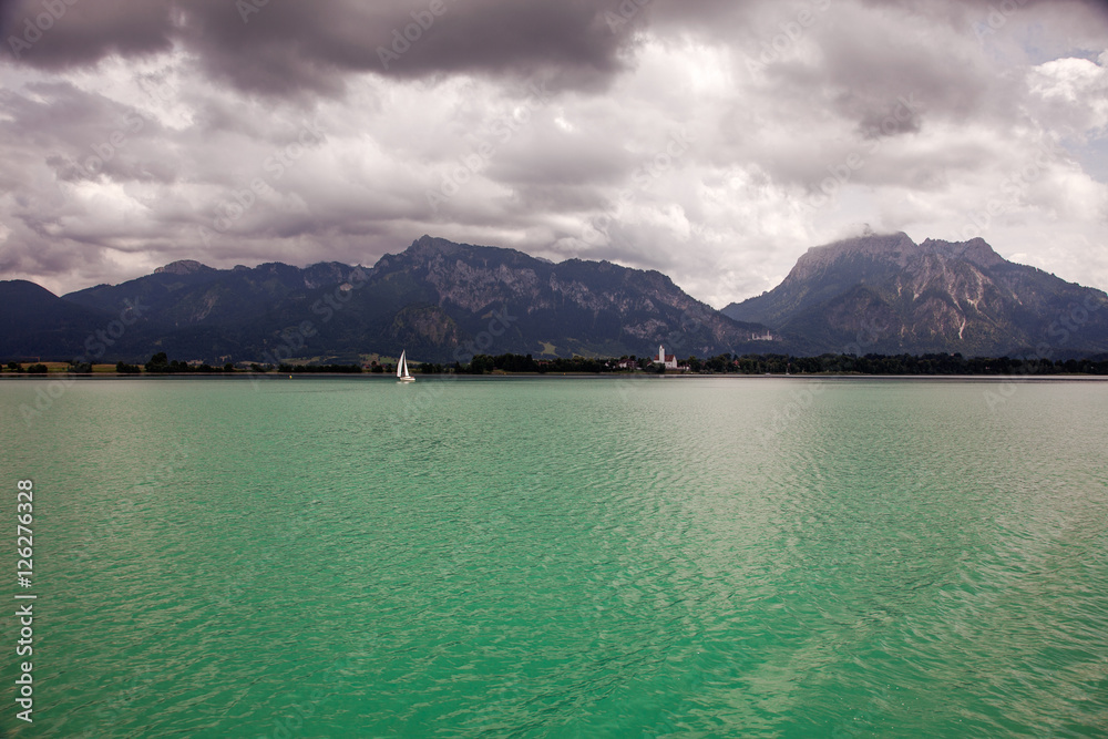 Boats and panoramic views of Forggensee lake, Germany