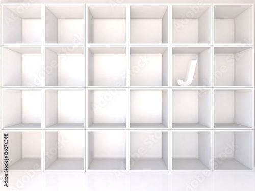 Empty white shelves with J