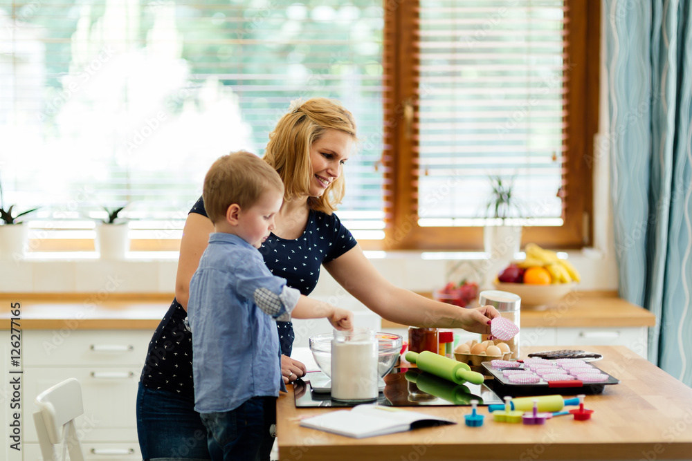Beautiful child and mother baking Beautiful child and mother baking