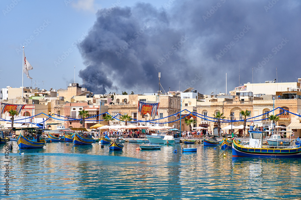 The view of fire accident in the Marsaxlokk fishing village, Malta