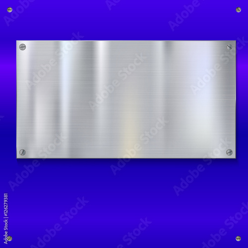 Shiny brushed metal plate with screws.