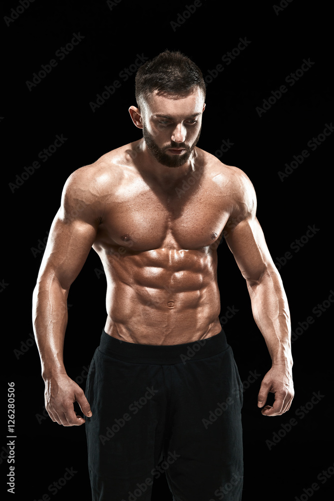 Muscular bodybuilder guy doing posing