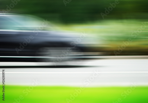 Horizontal car on road motion blur background