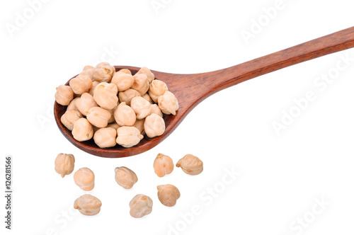 garbanzo beans in wooden spoon on white background