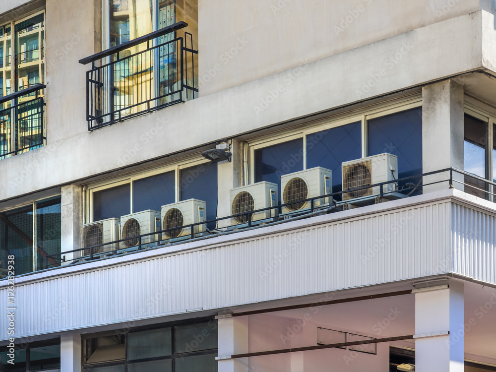 Obraz premium Small outdoor heater and air conditioner mounted on commercial building outdoor wall