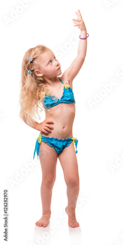 Little blond girl in bathing suit, hand lifted upwards isolated.