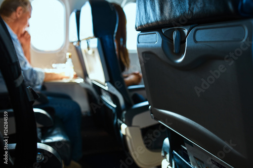 passanger in aircraft cabin. Interior passenger airliner cabin.