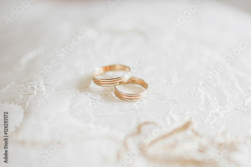 Wedding rings in golg photo