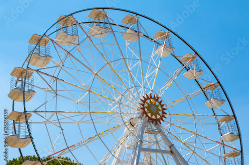 Ferris wheel in blue sky 