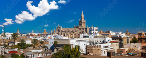 Panorama of Famous Bell Tower named Giralda in landmark catholic Cathedral Saint Mary of the See, aerial view from the Torre Del Oro, Seville, Andalusia, Spain