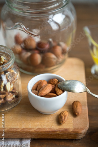 Assorted nuts: walnuts, almonds, hazelnuts and honey