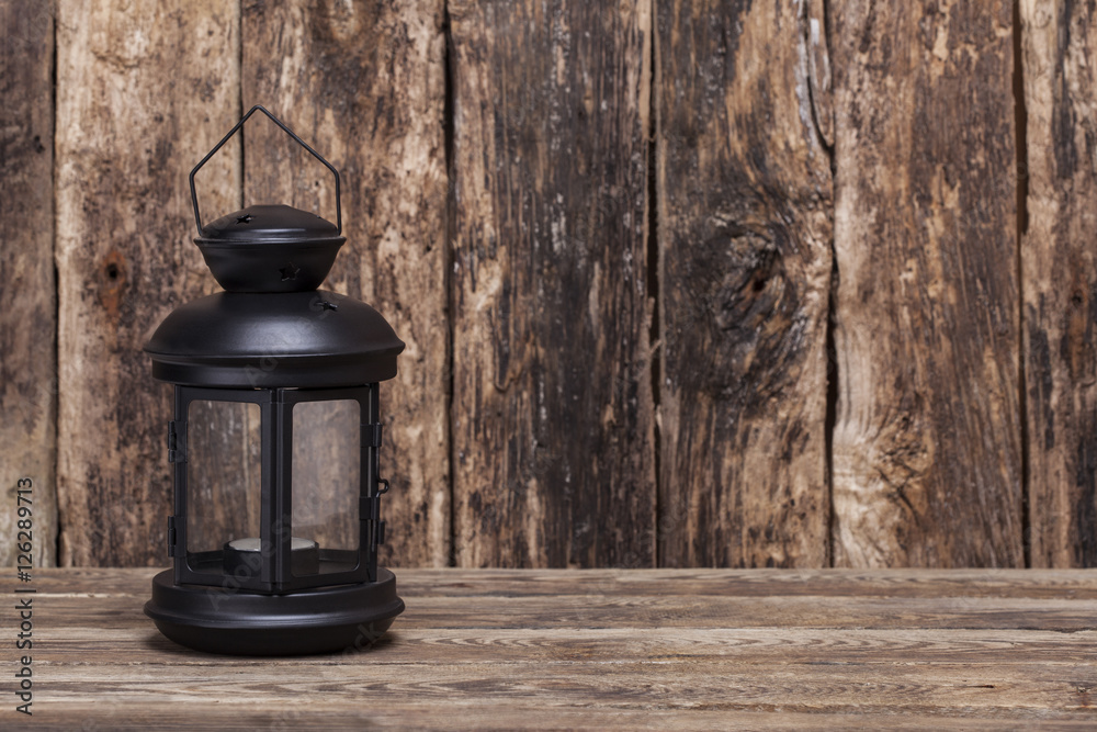 Christmas lantern on old wooden background Christmas lantern on old wooden background